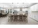 Modern kitchen with white cabinets, large island, and stainless steel appliances at 3810 Se 4Th Ter, Ocala, FL 34480