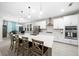 Modern kitchen with white cabinets, large island, and stainless steel appliances at 3810 Se 4Th Ter, Ocala, FL 34480