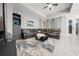 Spacious living room with a comfortable sectional sofa, stylish rug, and a ceiling fan at 3810 Se 4Th Ter, Ocala, FL 34480