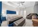 Relaxing main bedroom with a plush bed, ceiling fan, and a massage chair at 3810 Se 4Th Ter, Ocala, FL 34480