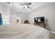 Spacious main bedroom with a large bed and access to the bathroom at 3810 Se 4Th Ter, Ocala, FL 34480