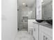 Bathroom with walk-in shower and double vanity at 39926 Parkinsonia St, Lady Lake, FL 32159