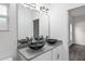 Bathroom with double vanity and modern lighting at 39926 Parkinsonia St, Lady Lake, FL 32159