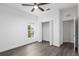 Spacious bedroom with double-door closet and wood-look floors at 39926 Parkinsonia St, Lady Lake, FL 32159