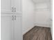 Large walk-in closet with shelving and cabinets at 39926 Parkinsonia St, Lady Lake, FL 32159