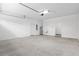Attached garage with utility sink and extra storage at 39926 Parkinsonia St, Lady Lake, FL 32159