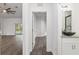 Bright hallway with views into living room and bathroom at 39926 Parkinsonia St, Lady Lake, FL 32159
