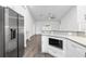 Modern kitchen with island, stainless steel appliances, and white cabinets at 39926 Parkinsonia St, Lady Lake, FL 32159