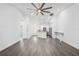 Modern kitchen with white cabinets, a breakfast bar, and grey flooring at 39926 Parkinsonia St, Lady Lake, FL 32159