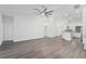 Open concept kitchen with white cabinets and a breakfast bar at 39926 Parkinsonia St, Lady Lake, FL 32159