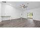Spacious living room featuring hardwood floors and a ceiling fan at 39926 Parkinsonia St, Lady Lake, FL 32159