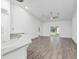 Spacious living room with hardwood floors and sliding glass doors at 39926 Parkinsonia St, Lady Lake, FL 32159