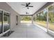 Covered screened lanai offers outdoor space with ceiling fans at 39926 Parkinsonia St, Lady Lake, FL 32159