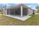 Screened lanai view from the backyard, offering shade and outdoor space at 39926 Parkinsonia St, Lady Lake, FL 32159