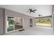 Spacious screened lanai with ceiling fans, great for relaxing outdoors at 39926 Parkinsonia St, Lady Lake, FL 32159