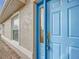 Blue front door with glass accents and keypad lock at 5309 Sw 89Th Pl, Ocala, FL 34476