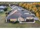 Daytime aerial shot of the single-story home with a backyard patio at 7102 Sw 91St Ct, Ocala, FL 34481