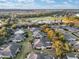 Aerial perspective of a golf course community with homes and trees at 7102 Sw 91St Ct, Ocala, FL 34481