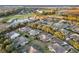 Scenic aerial view of a golf course community with lush landscaping and charming homes at 7102 Sw 91St Ct, Ocala, FL 34481
