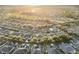 Aerial view of a neighborhood in a golf community as the sunsets at 7102 Sw 91St Ct, Ocala, FL 34481