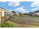 Expansive backyard view of the home and surrounding community at 7102 Sw 91St Ct, Ocala, FL 34481