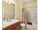 Full bathroom with shower/tub combo, vanity, and tile flooring at 7102 Sw 91St Ct, Ocala, FL 34481