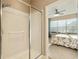 Clean bathroom with shower, vanity, and attached bedroom at 7102 Sw 91St Ct, Ocala, FL 34481