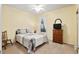 Cozy bedroom with ceiling fan, carpeted floors, and ample natural light at 7102 Sw 91St Ct, Ocala, FL 34481