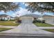 One-story home with a double garage and neatly landscaped yard at 7102 Sw 91St Ct, Ocala, FL 34481