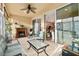 Cozy Florida room with fireplace and access to the main living area at 7102 Sw 91St Ct, Ocala, FL 34481