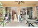 Florida room with sliding glass doors, offering views of the kitchen and living area at 7102 Sw 91St Ct, Ocala, FL 34481
