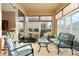 Bright Florida room with sliding glass doors, perfect for relaxation at 7102 Sw 91St Ct, Ocala, FL 34481