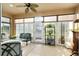 Bright Florida room with sliding glass doors, perfect for relaxation at 7102 Sw 91St Ct, Ocala, FL 34481