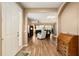 Foyer with wood flooring and view into the living area at 7102 Sw 91St Ct, Ocala, FL 34481