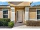 Welcoming entryway with a white front door and decorative accents at 7102 Sw 91St Ct, Ocala, FL 34481