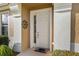 Close-up of the front door with decorative metal artwork at 7102 Sw 91St Ct, Ocala, FL 34481