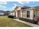 Inviting front yard landscaping leads to a covered entryway at 7102 Sw 91St Ct, Ocala, FL 34481