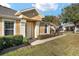 Front yard with lush landscaping and a walkway leading to the entrance at 7102 Sw 91St Ct, Ocala, FL 34481