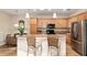 Modern kitchen with stainless steel appliances, wood cabinets, and ample counter space at 7102 Sw 91St Ct, Ocala, FL 34481
