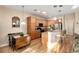 Functional kitchen with wood cabinets, breakfast bar, and adjacent dining area at 7102 Sw 91St Ct, Ocala, FL 34481