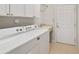 Laundry room with washer, dryer, and built-in sink at 7102 Sw 91St Ct, Ocala, FL 34481