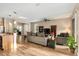 Bright and airy living room with wood floors, a ceiling fan, and ample natural light at 7102 Sw 91St Ct, Ocala, FL 34481