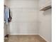Spacious walk-in closet with ample shelving and carpeted floor at 7102 Sw 91St Ct, Ocala, FL 34481