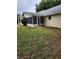 Back exterior view of house with screened porch and grassy yard at 8836 Sw 90Th Ln # B, Ocala, FL 34481