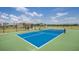 Pickleball court with a shaded viewing area at 9304 Sw 60Th Court Rd, Ocala, FL 34476