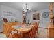 Charming dining room with wood table and chandelier at 10120 Sw 49Th Ave, Ocala, FL 34476