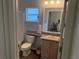 Bathroom with single sink vanity, toilet and bathtub at 10913 Sw 69Th Cir, Ocala, FL 34476