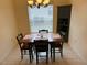 Dining room with built-in corner cabinet and wood table at 10913 Sw 69Th Cir, Ocala, FL 34476