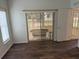 Living room with sliding doors to a screened porch at 10913 Sw 69Th Cir, Ocala, FL 34476