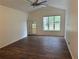 Bright living room with wood-look floors and backyard access at 10913 Sw 69Th Cir, Ocala, FL 34476